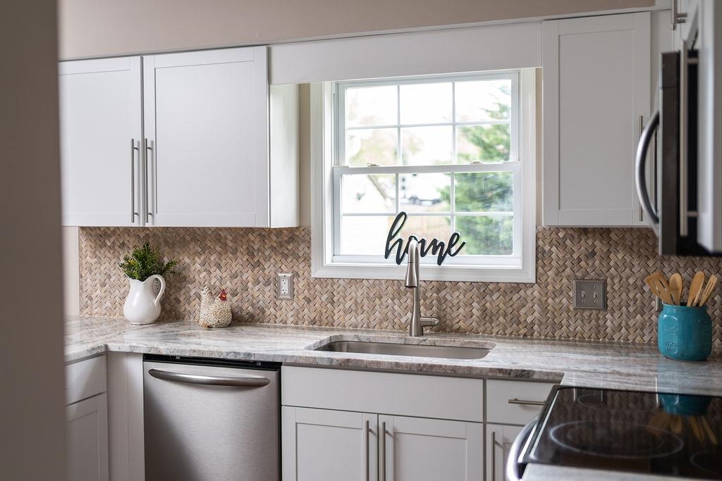 26 Long Bow Road Waynesboro, VA 22980 - Photo 23 of 72 a kitchen with stainless steel appliances granite countertop a sink a stove and a window