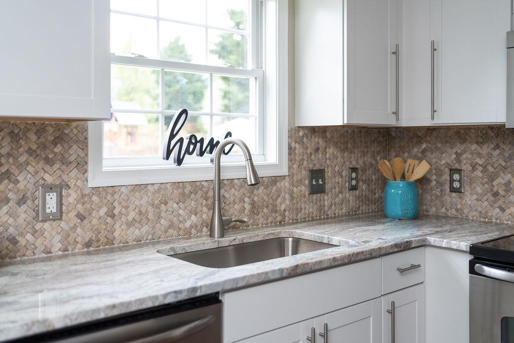26 Long Bow Road Waynesboro, VA 22980 - Photo 24 of 72 a kitchen with granite countertop a sink and a window