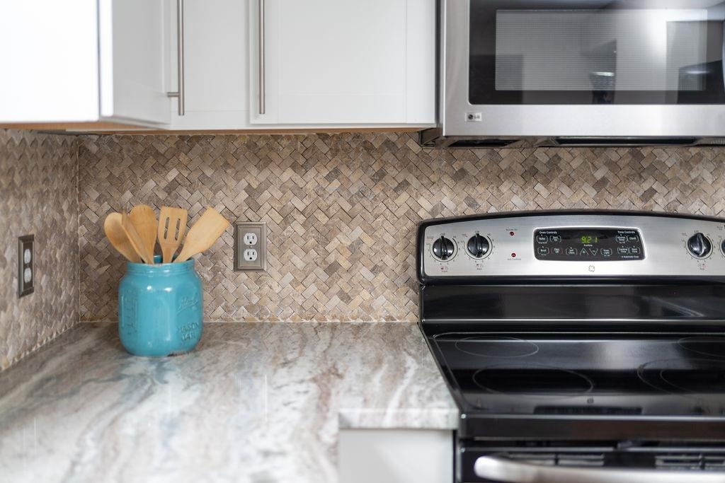 26 Long Bow Road Waynesboro, VA 22980 - Photo 26 of 72 a kitchen with a stove and a microwave