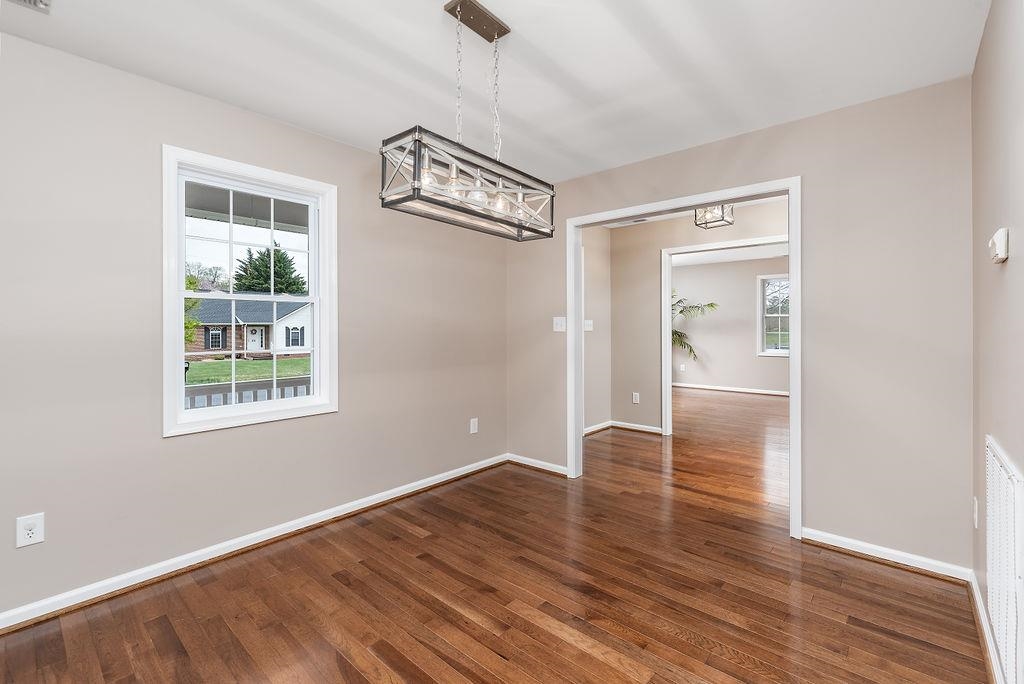 26 Long Bow Road Waynesboro, VA 22980 - Photo 29 of 72 a view of an empty room with wooden floor and a window