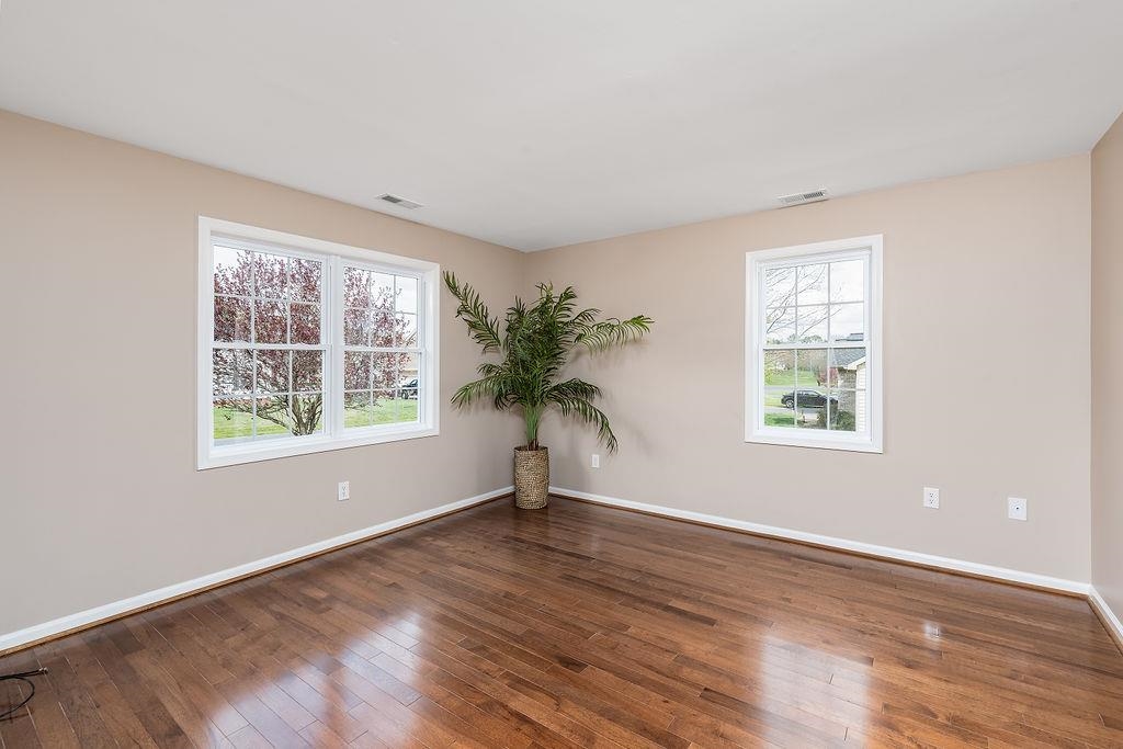 26 Long Bow Road Waynesboro, VA 22980 - Photo 8 of 72 a view of an empty room with a window and wooden floor