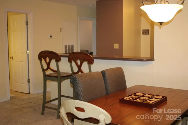 a view of a livingroom with furniture and a table