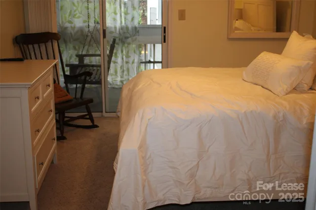 a bedroom with a bed and a mirror