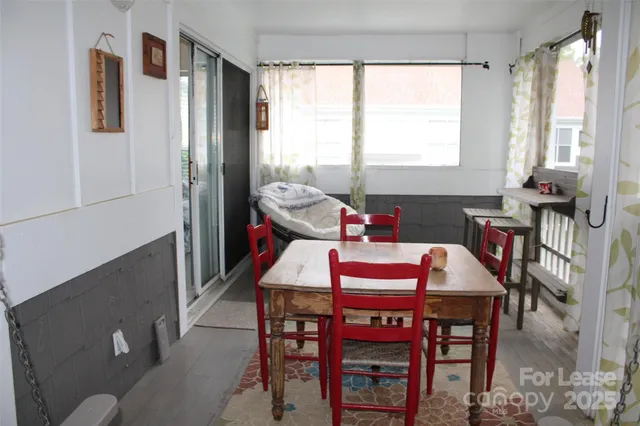 a dining room with furniture and window