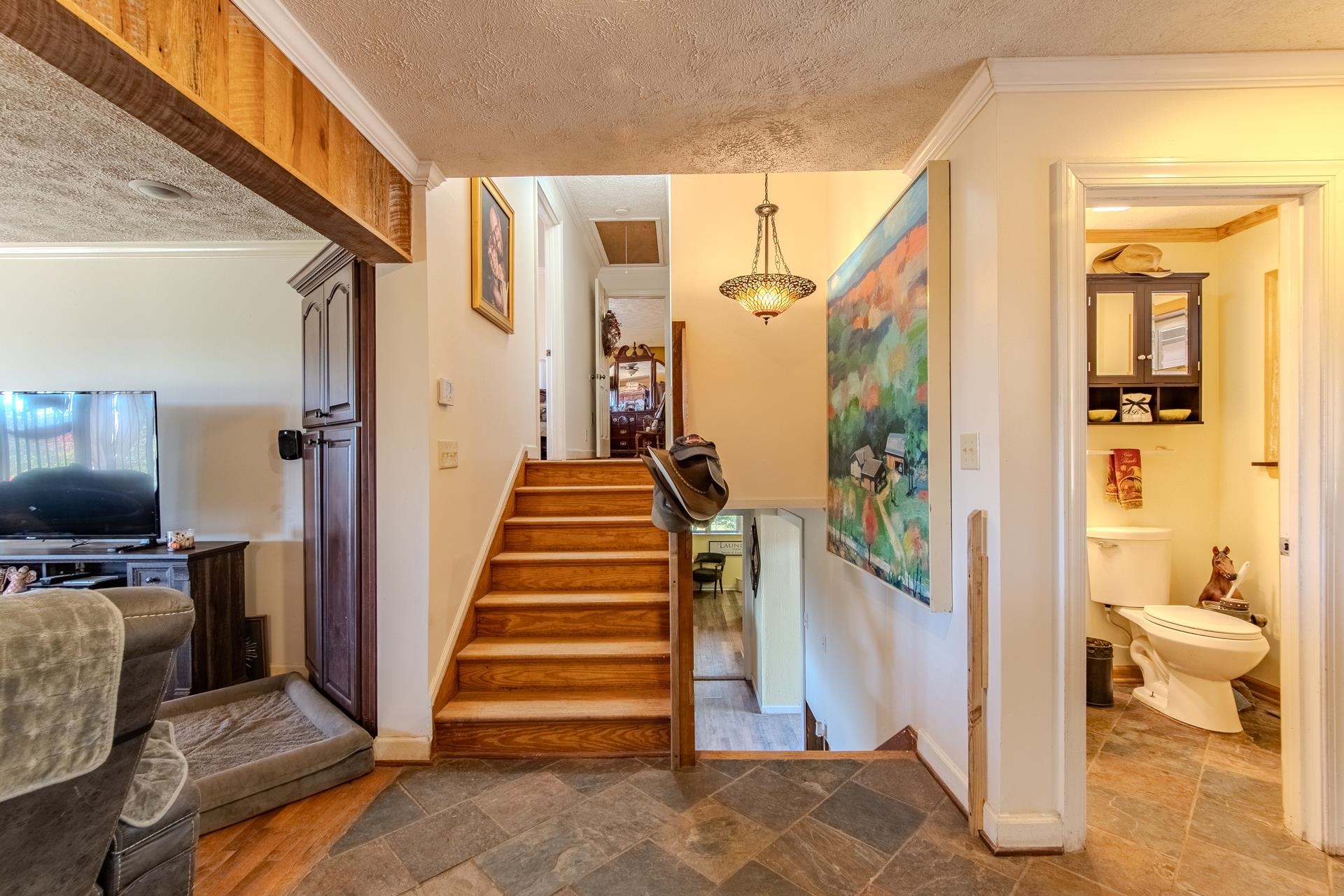 3540 Damon Road Michie, TN 38357 - Photo 16 of 40 a view of a hallway with wooden floor and staircase