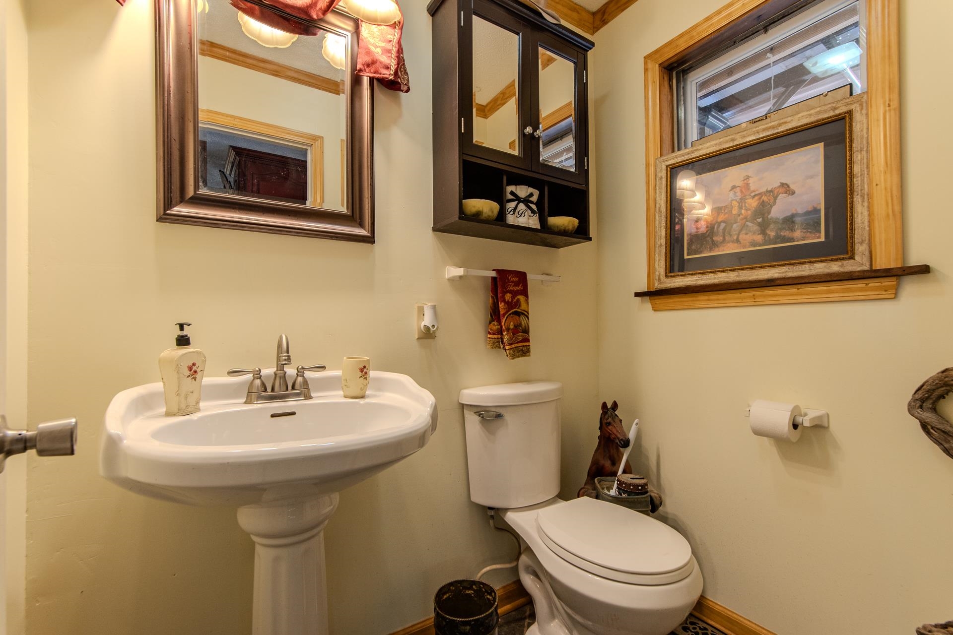 3540 Damon Road Michie, TN 38357 - Photo 17 of 40 a bathroom with a toilet sink and mirror