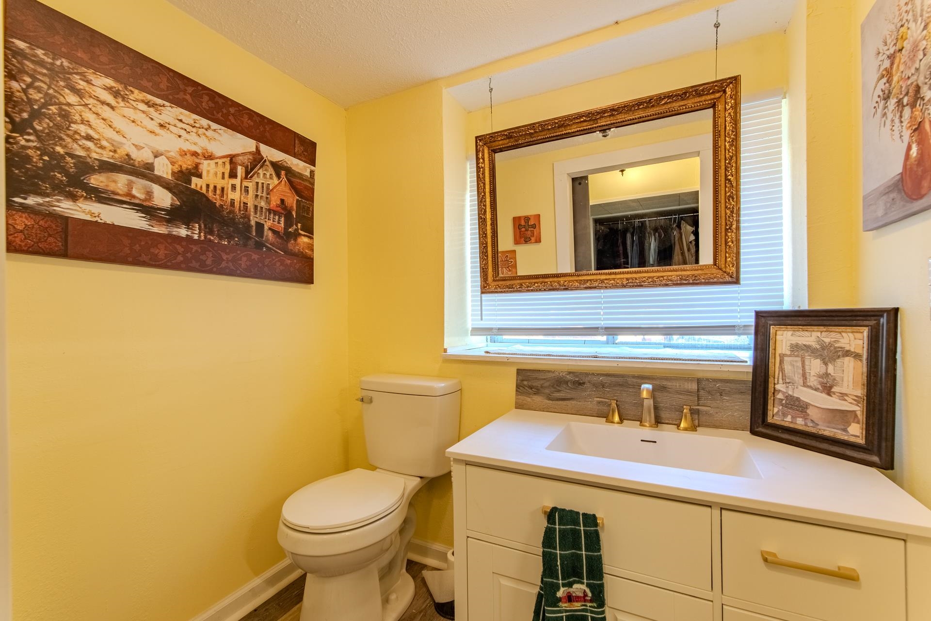 3540 Damon Road Michie, TN 38357 - Photo 20 of 40 a bathroom with a toilet sink and mirror