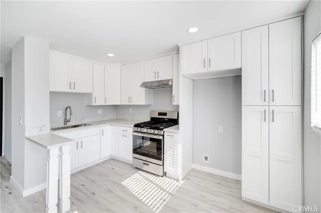 a view of a cars park in front of building