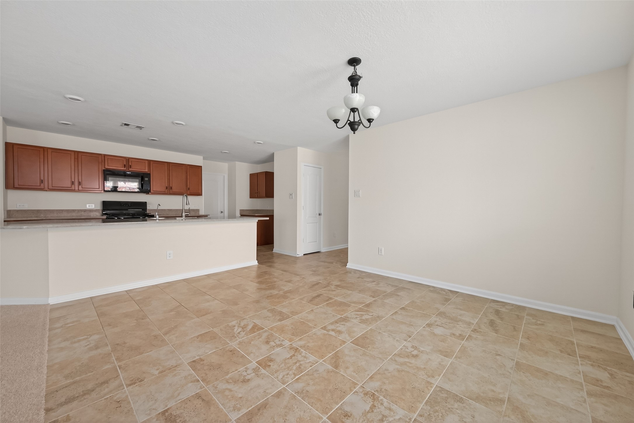 2754 Cayden Creek Way Conroe, TX 77304 - Photo 7 of 40 a view of a kitchen with a sink and cabinets