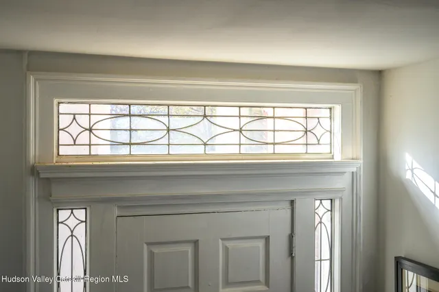 a view of a brick house with a large windows