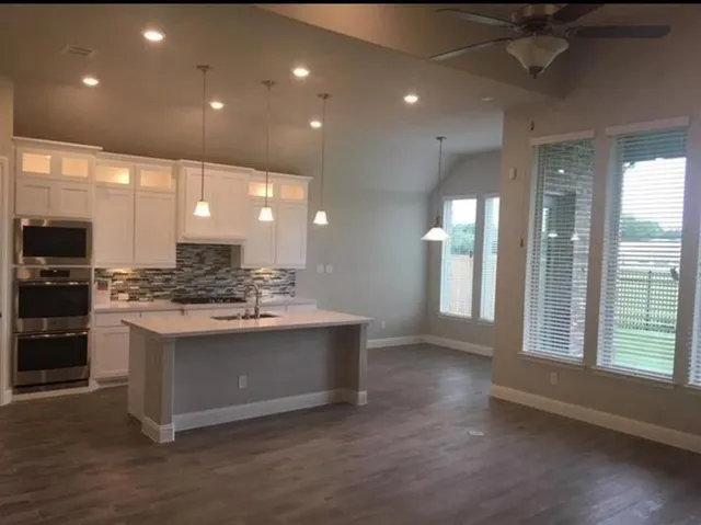 a view of kitchen with cabinets and stainless steel appliances