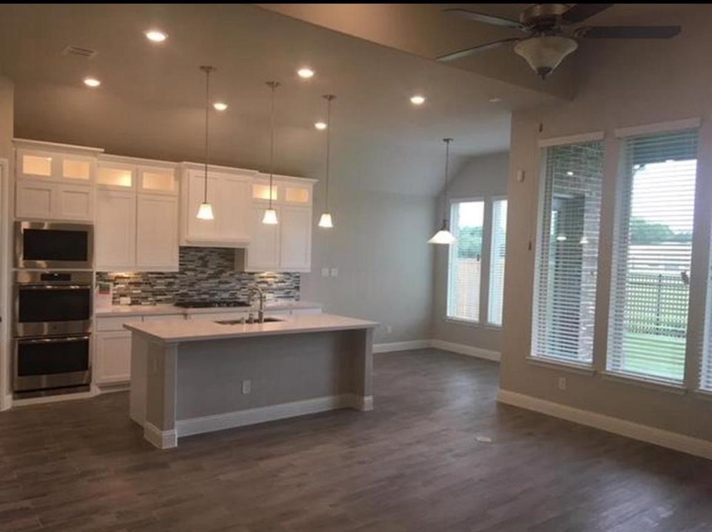 a view of kitchen with cabinets and stainless steel appliances