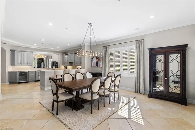 a view of a dining room with furniture and window