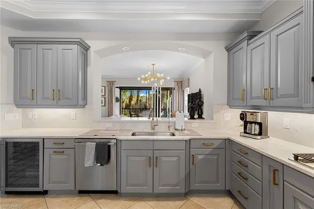 a kitchen with stainless steel appliances granite countertop a sink and cabinets