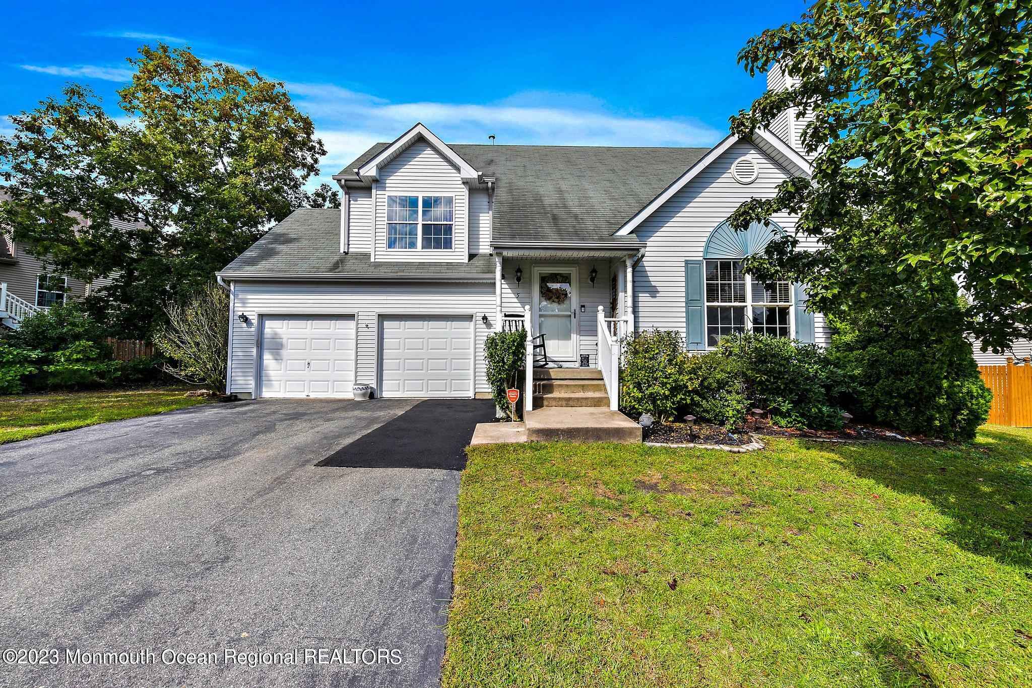 5 Stonegate Drive Little Egg Harbor, NJ 08087 - Photo 1 of 36 a front view of a house with a yard and garage