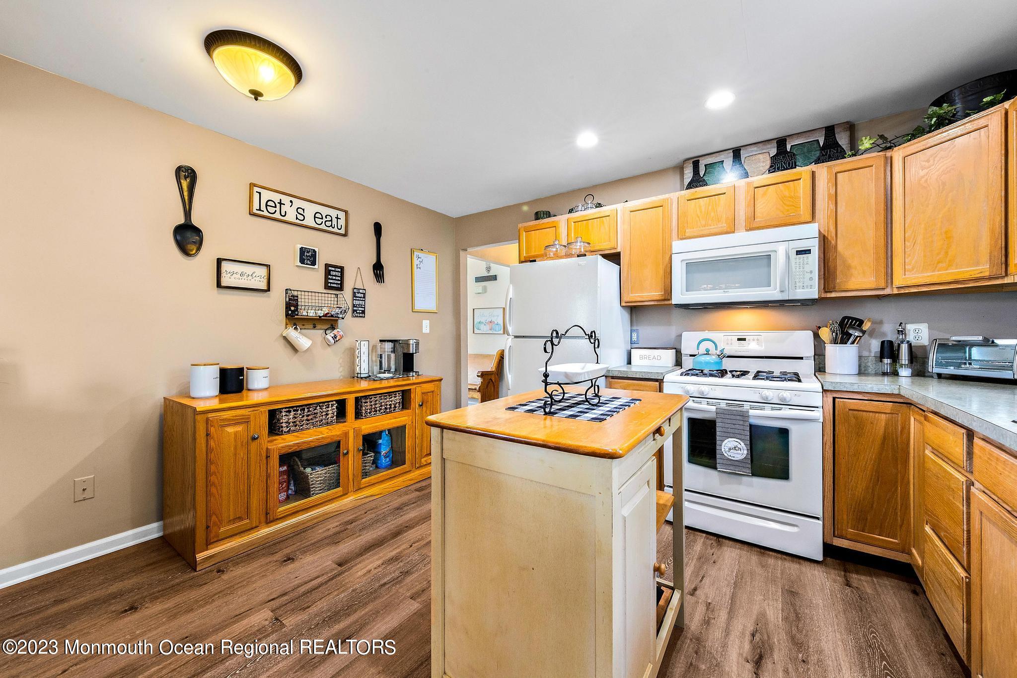 5 Stonegate Drive Little Egg Harbor, NJ 08087 - Photo 17 of 36 a kitchen with stainless steel appliances granite countertop a stove and a sink