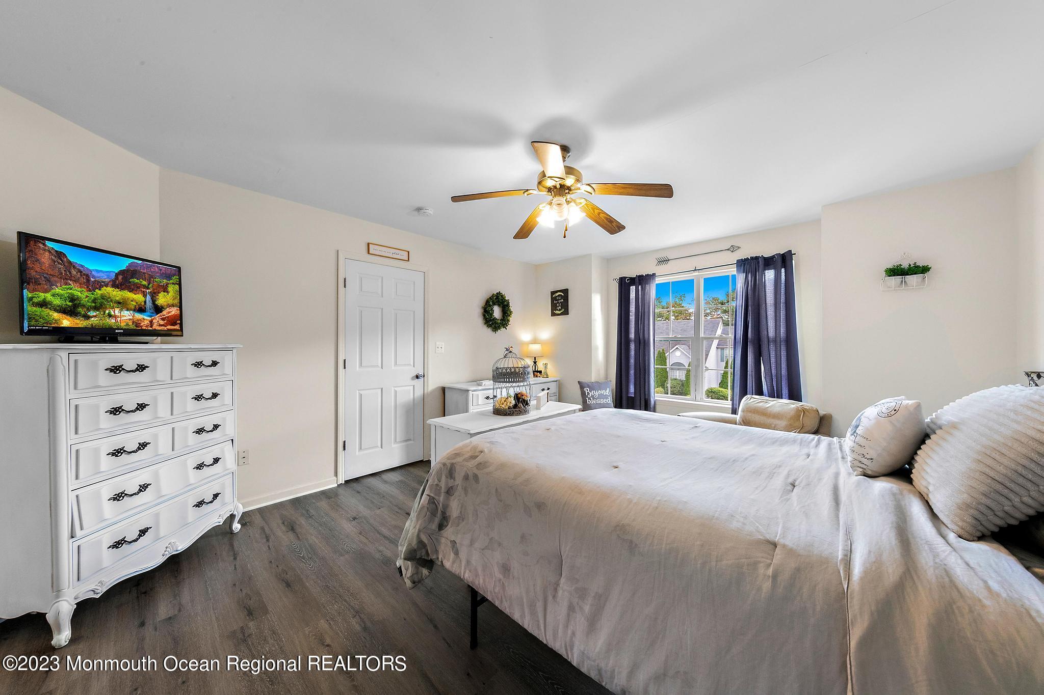5 Stonegate Drive Little Egg Harbor, NJ 08087 - Photo 21 of 36 a bedroom with a bed and a flat screen tv