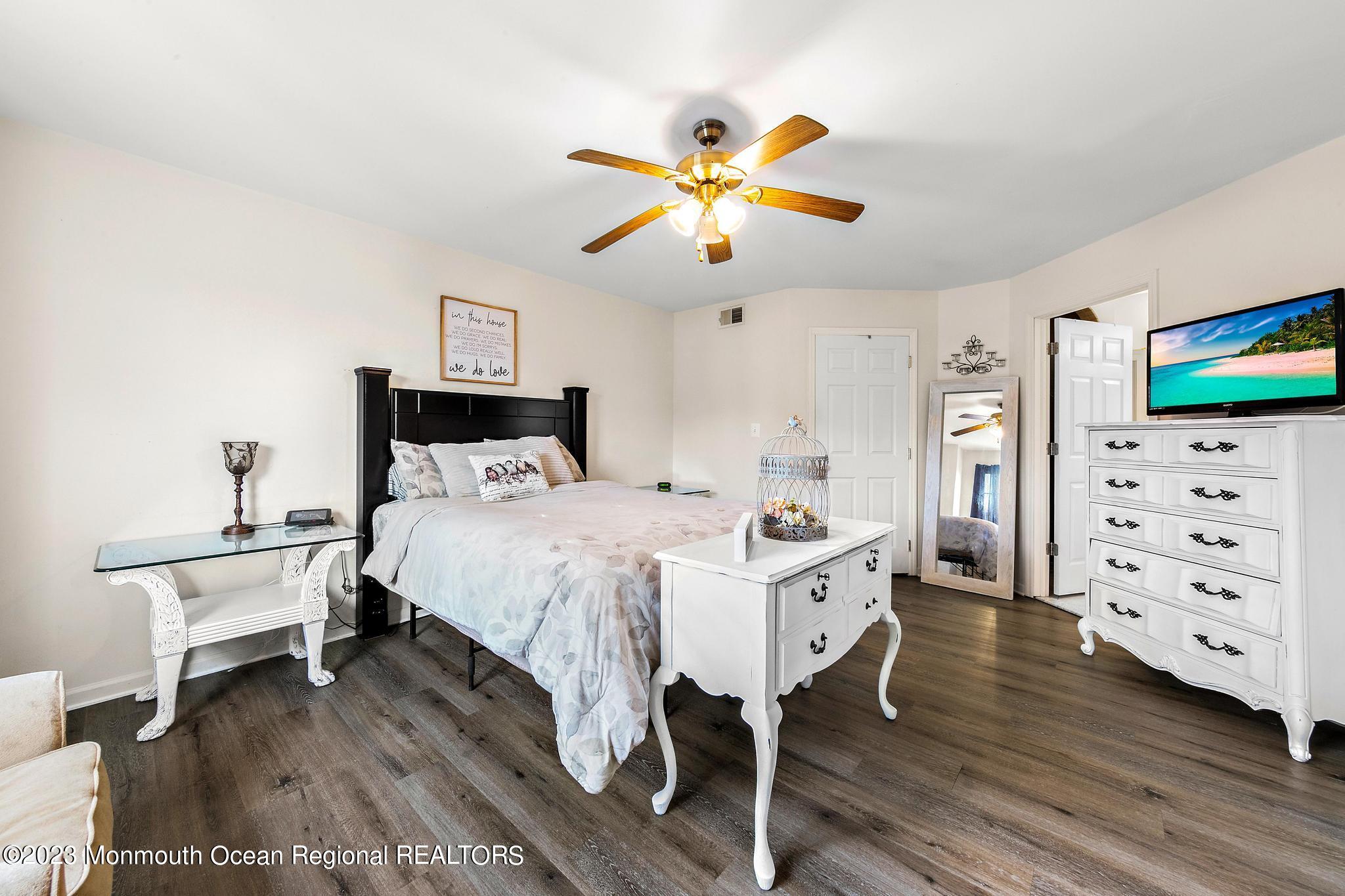 5 Stonegate Drive Little Egg Harbor, NJ 08087 - Photo 22 of 36 a bedroom with a bed and a flat screen tv