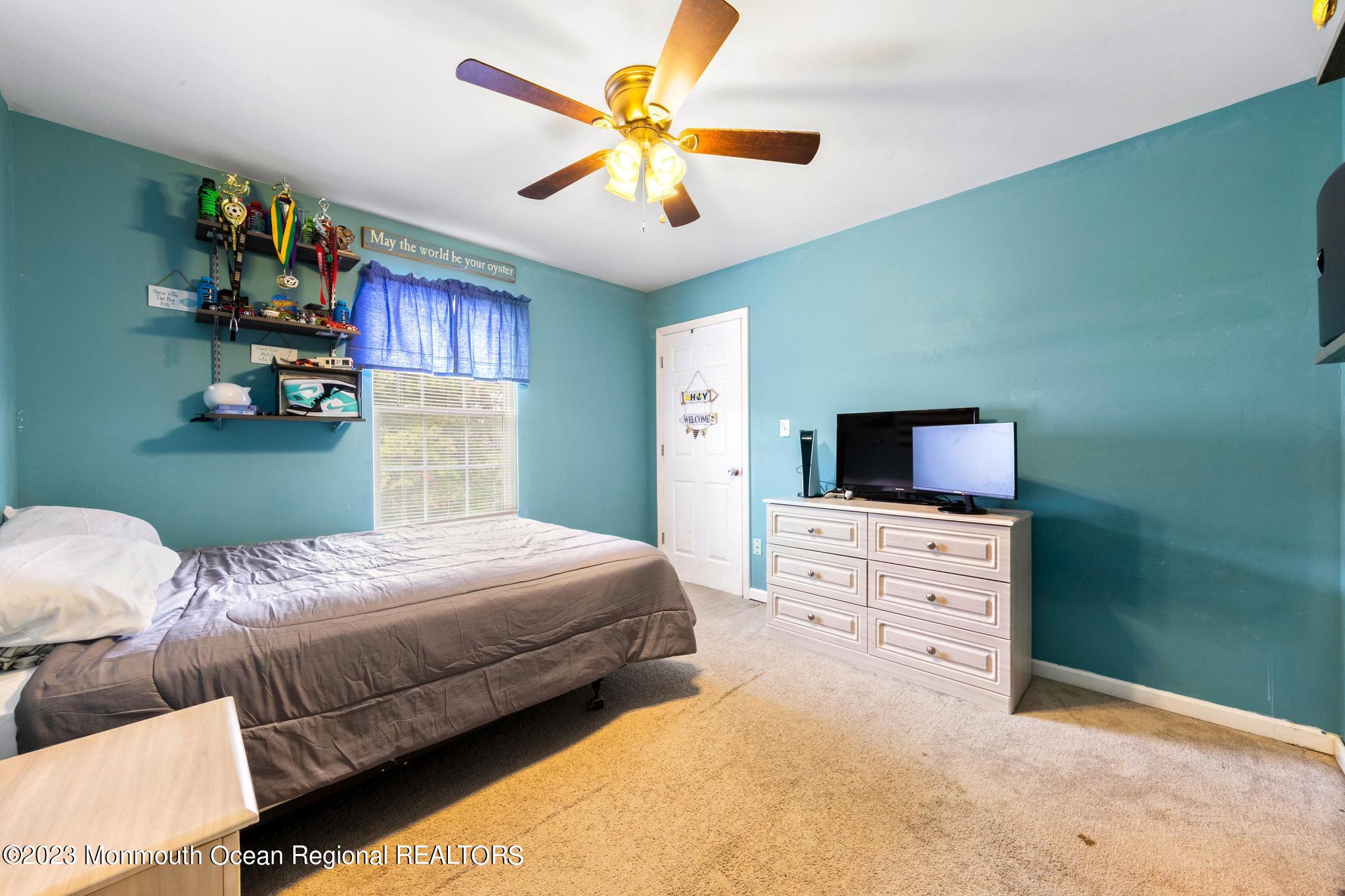 5 Stonegate Drive Little Egg Harbor, NJ 08087 - Photo 26 of 36 a bedroom with a bed and a flat screen tv