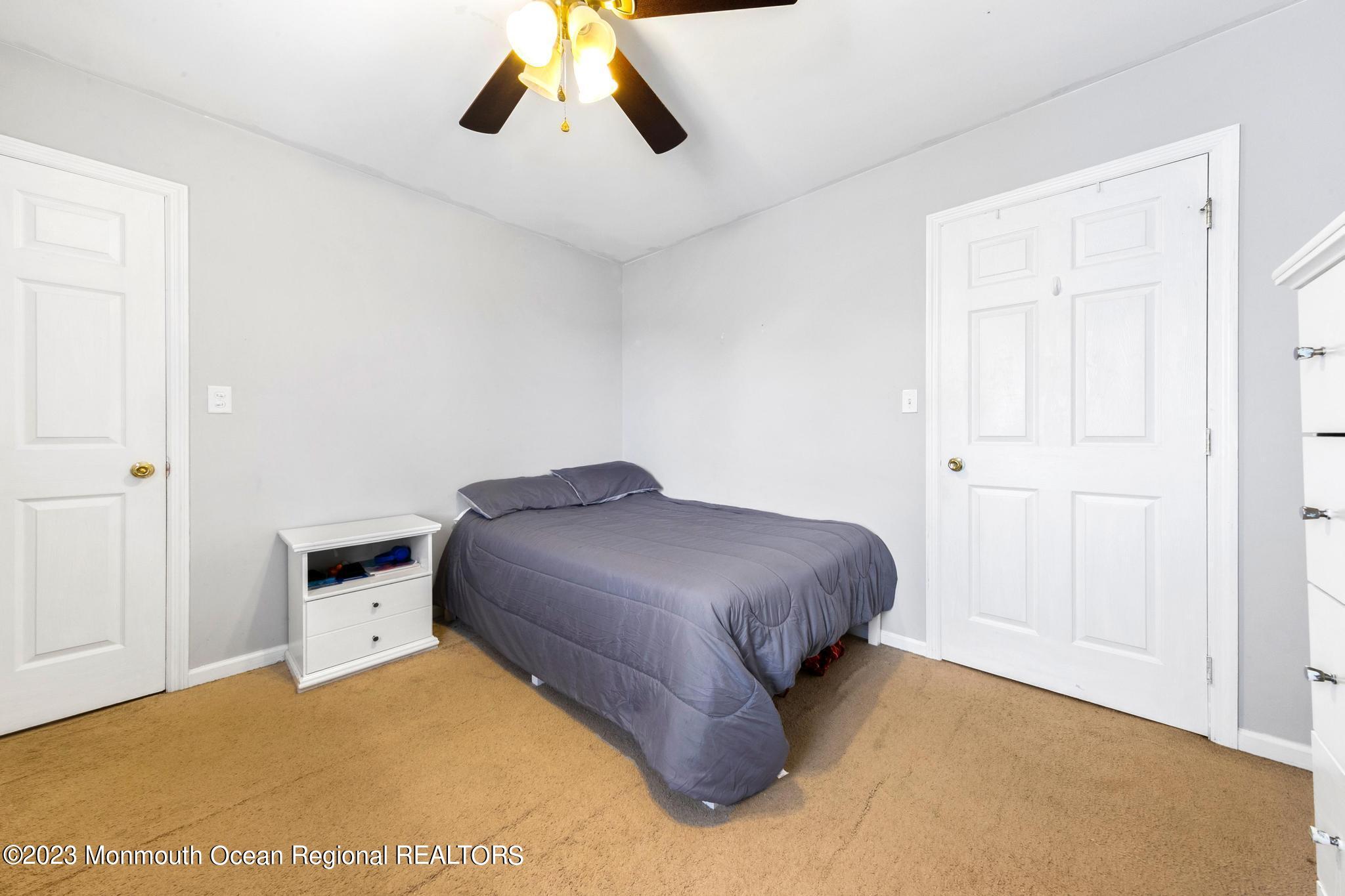 5 Stonegate Drive Little Egg Harbor, NJ 08087 - Photo 29 of 36 a bedroom with a bed and cabinets