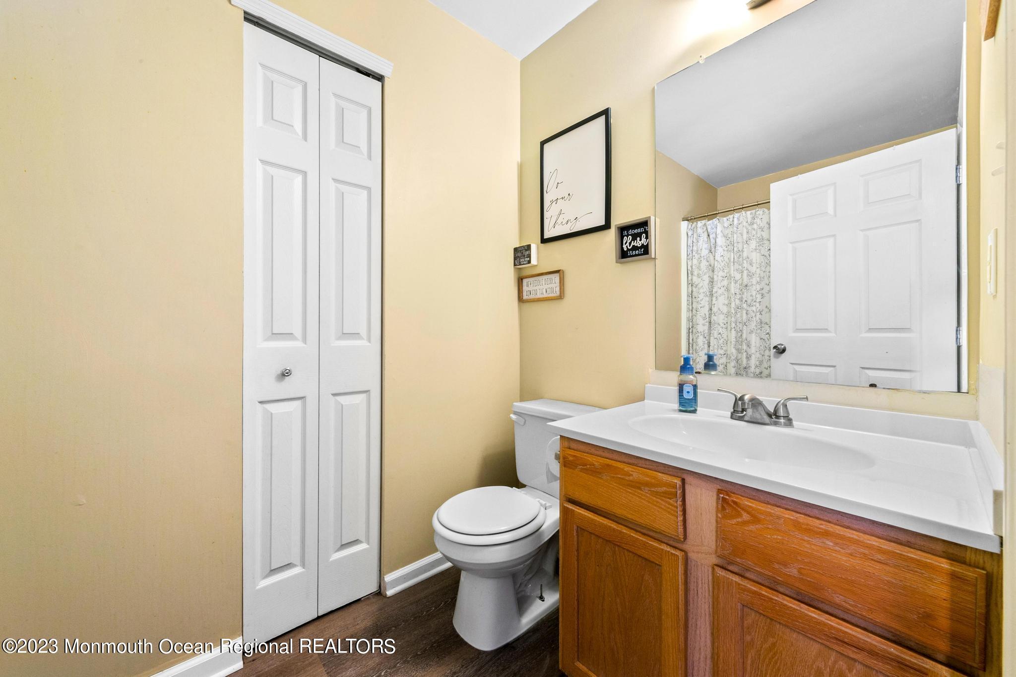 5 Stonegate Drive Little Egg Harbor, NJ 08087 - Photo 30 of 36 a bathroom with a sink a toilet and a mirror