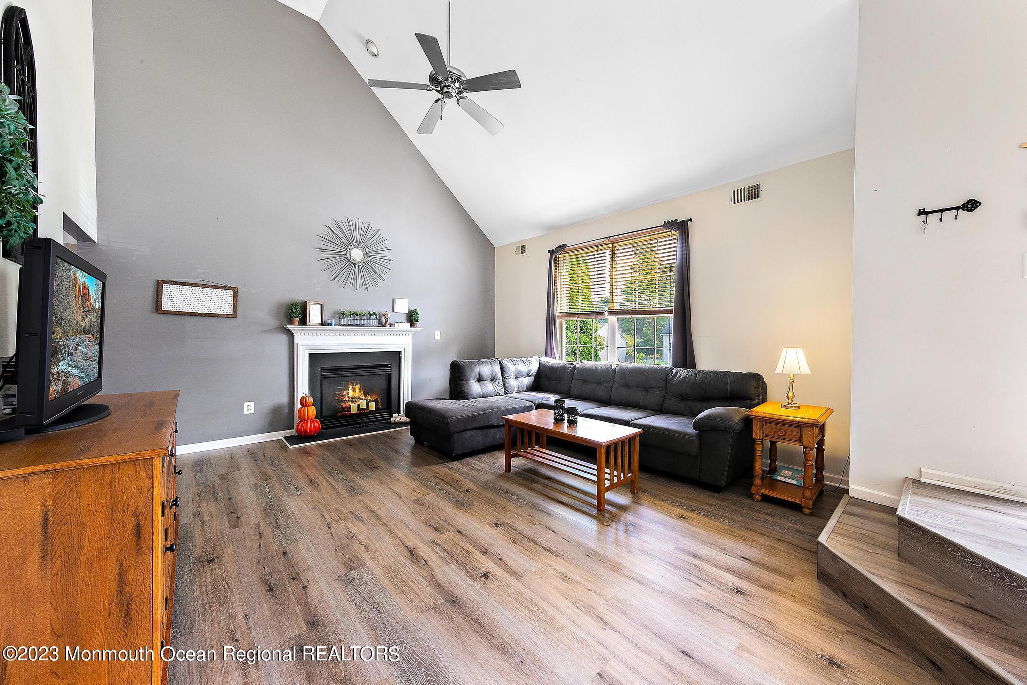 5 Stonegate Drive Little Egg Harbor, NJ 08087 - Photo 5 of 36 a living room with furniture and a fireplace