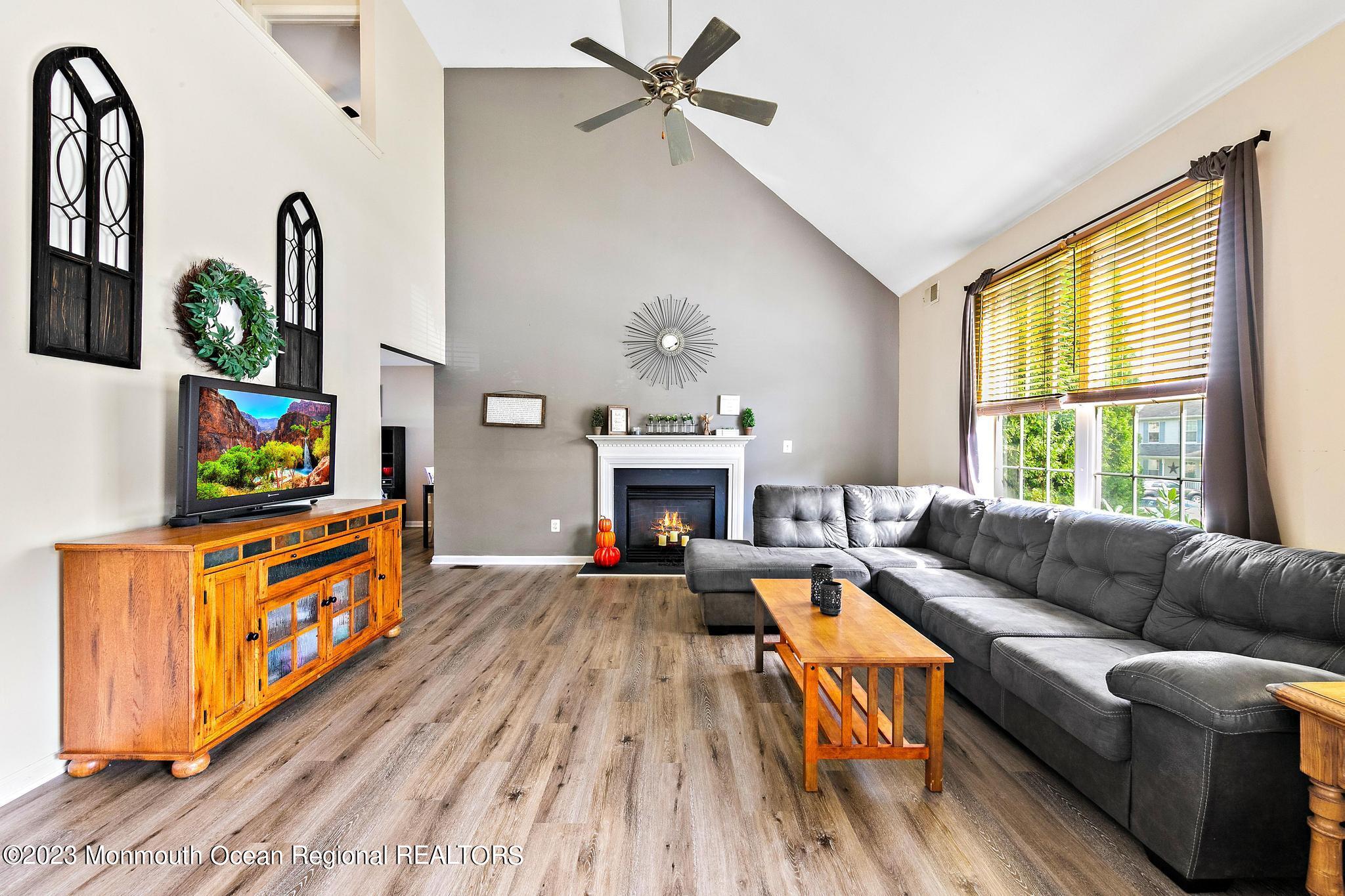 5 Stonegate Drive Little Egg Harbor, NJ 08087 - Photo 6 of 36 a living room with furniture and a fireplace