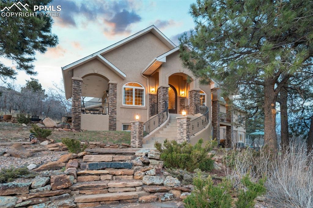 a front view of a house with garden