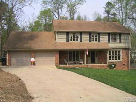 7405 Baystone Court Raleigh, NC 27615 - Photo 1 of 10 a view of a house with yard and garden