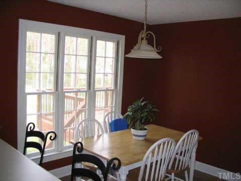 7405 Baystone Court Raleigh, NC 27615 - Photo 6 of 10 a dining room with furniture and window
