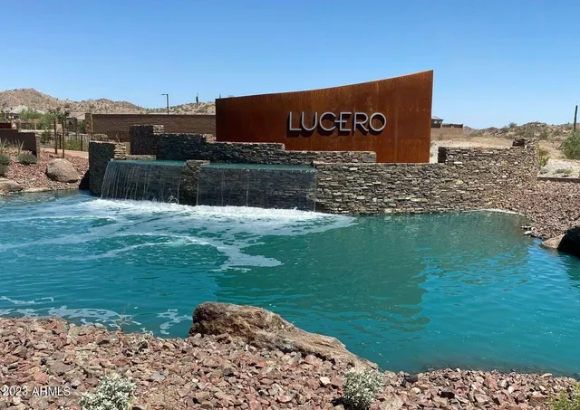 a view of a sign board with a yard