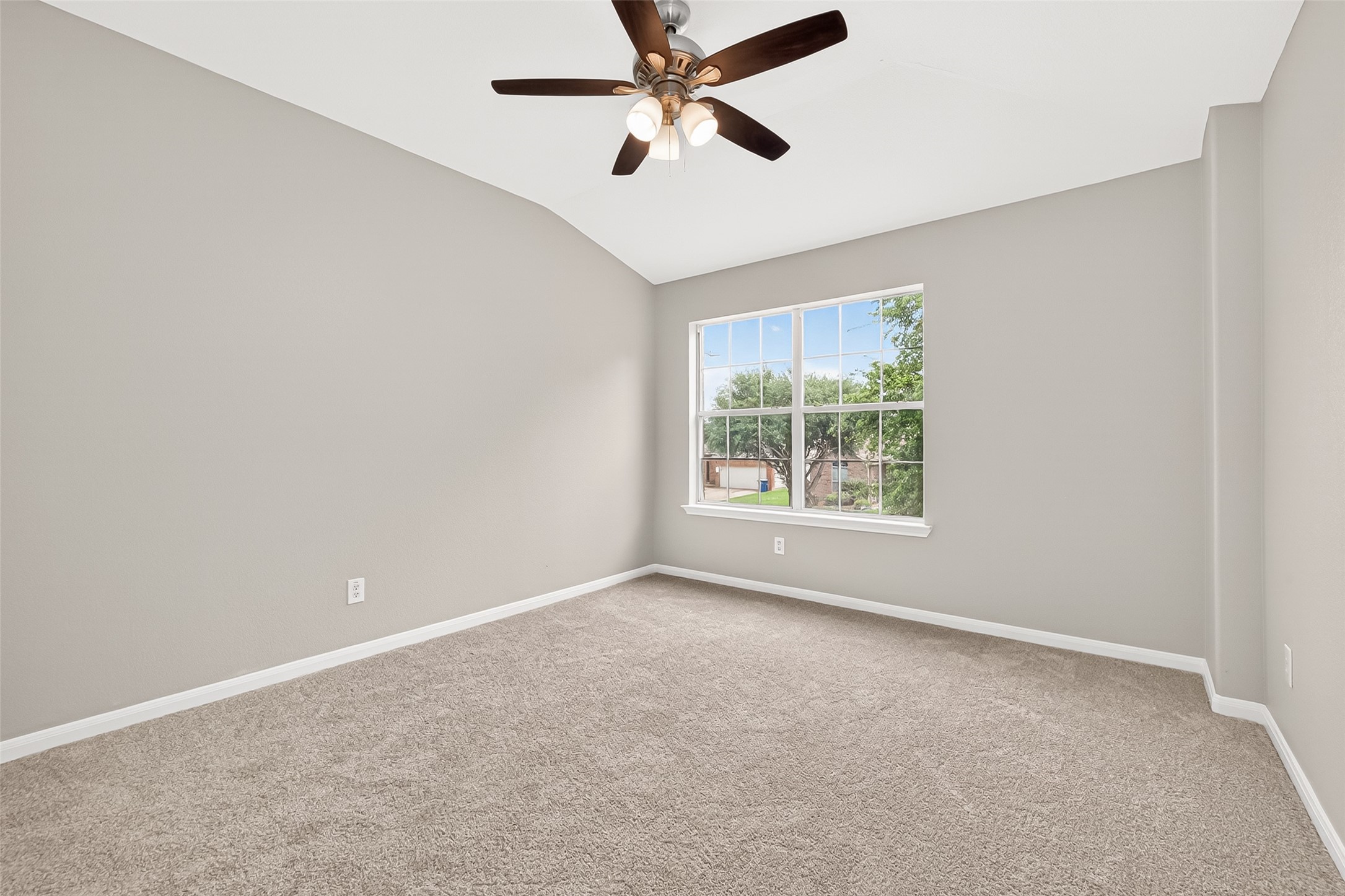 21327 Bella Flora Court Spring, TX 77379 - Photo 34 of 50 an empty room with windows and fan