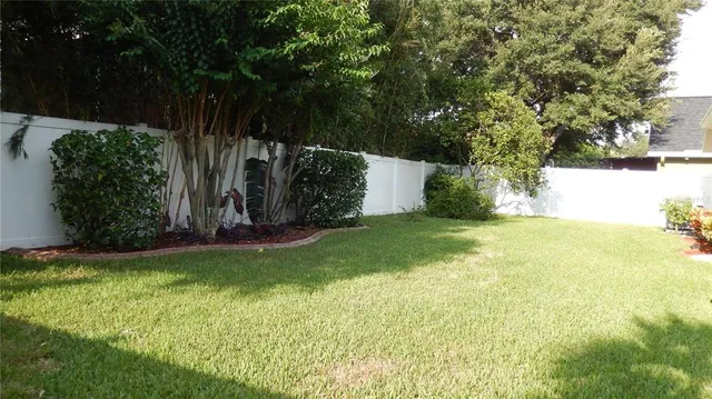 a view of swimming pool from a yard
