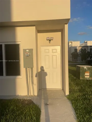 a view of a door front of the house