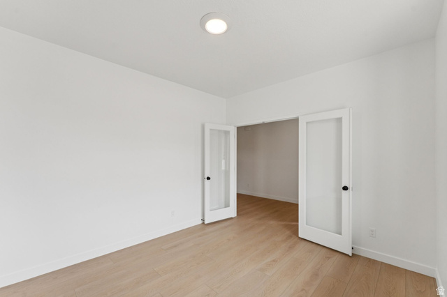 1004 West Paramount Cove South, Unit 315 Ogden, UT 84405 - Photo 17 of 42 Main floor office featuring light wood-finish flooring, recessed ceiling lighting, crisp white walls, and white baseboards