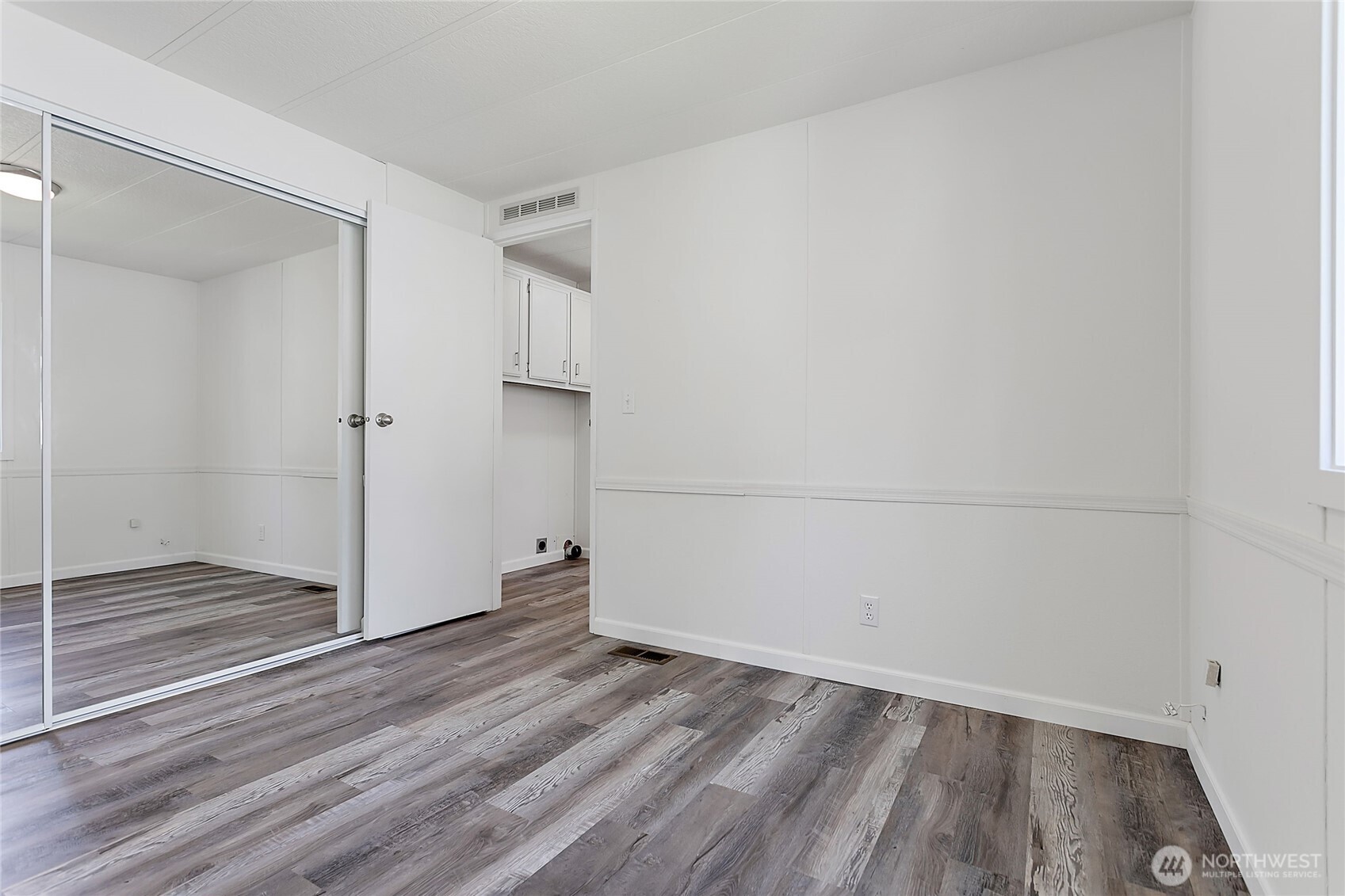 921 Autumn Lane, Unit 243 Bellingham, WA 98229 - Photo 14 of 24 a view of empty room with wooden floor