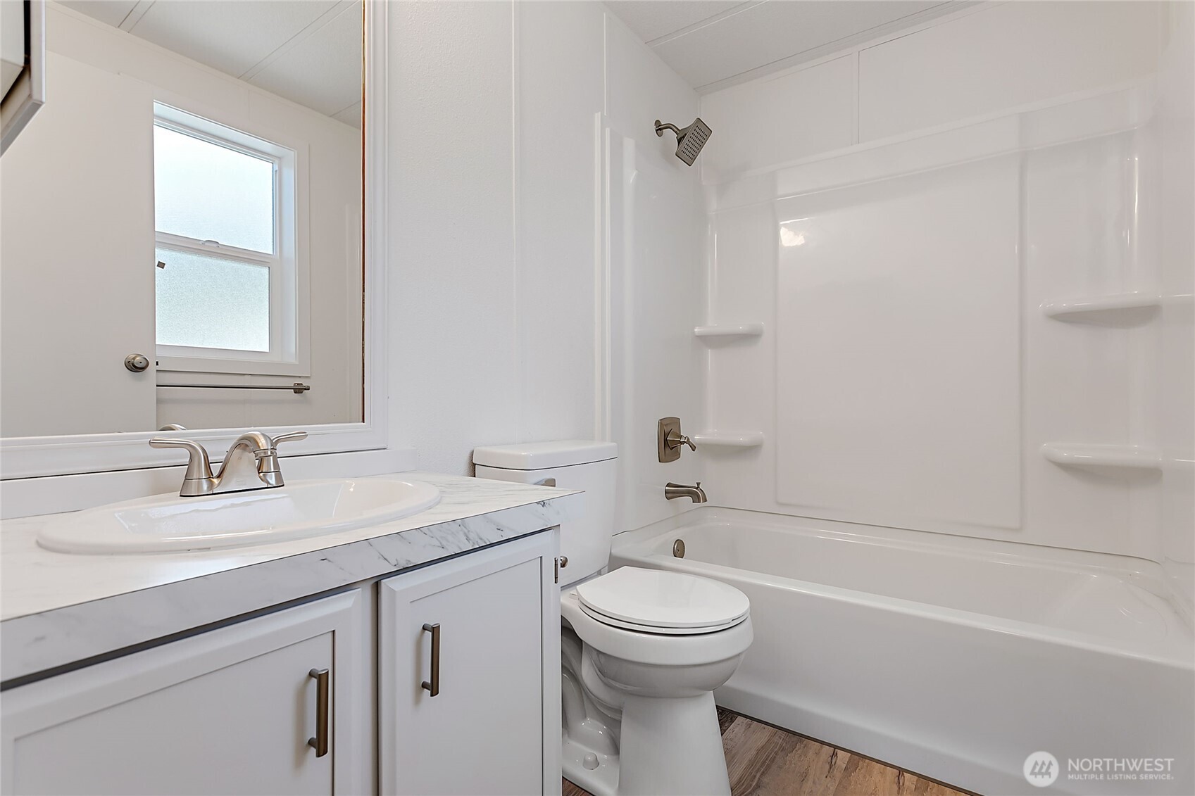 921 Autumn Lane, Unit 243 Bellingham, WA 98229 - Photo 15 of 24 a bathroom with a sink a toilet and shower