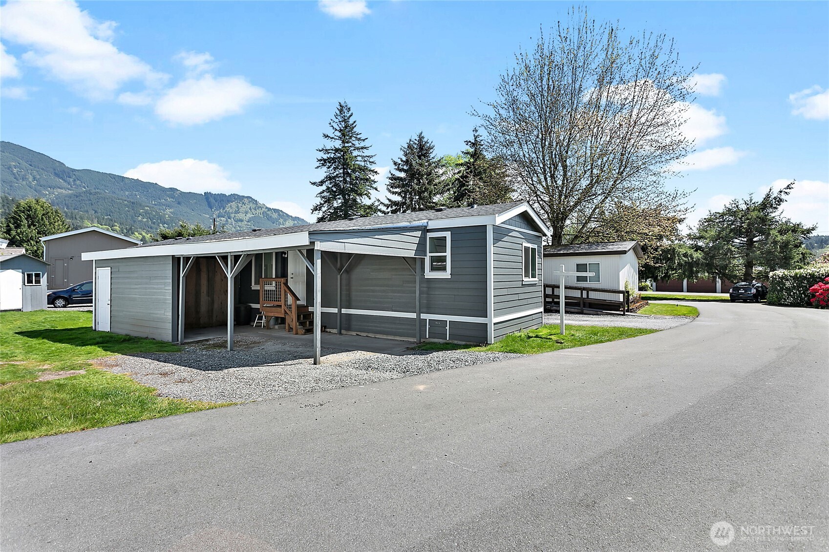 921 Autumn Lane, Unit 243 Bellingham, WA 98229 - Photo 2 of 24 a view of a house with a yard and large tree