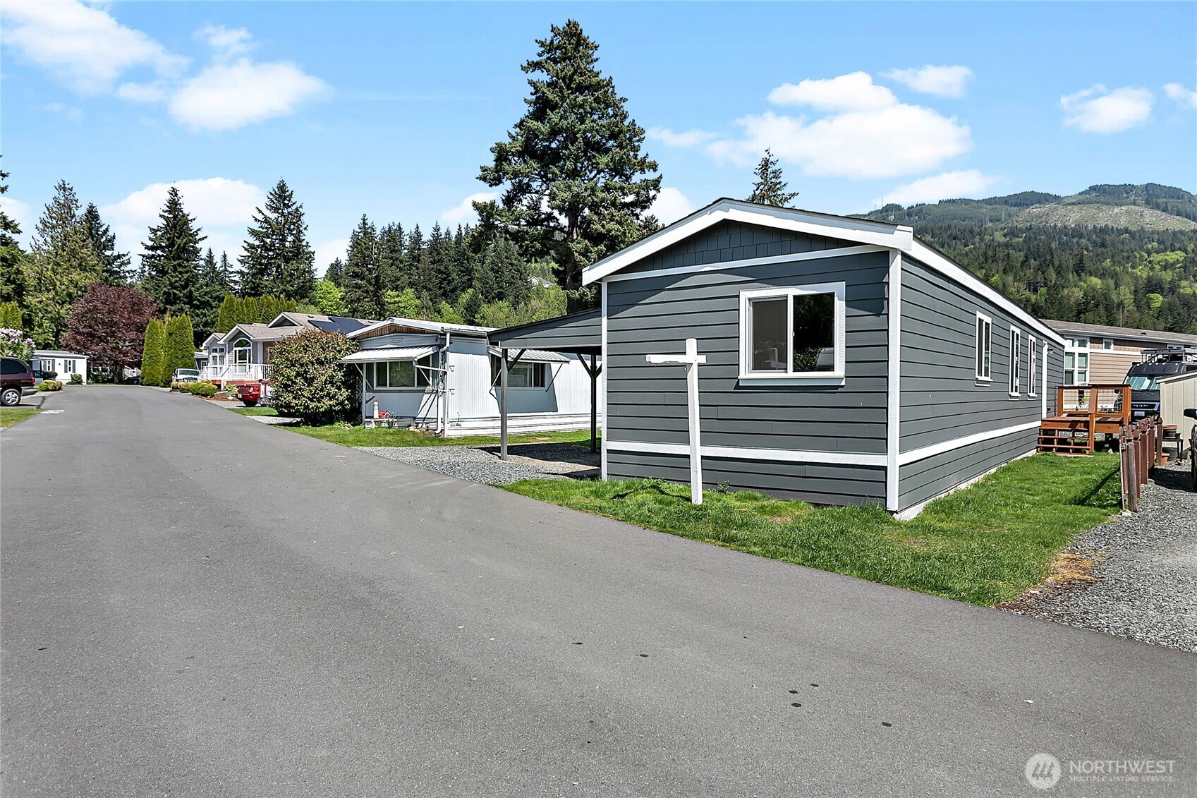921 Autumn Lane, Unit 243 Bellingham, WA 98229 - Photo 3 of 24 a front view of a house with a yard and garage