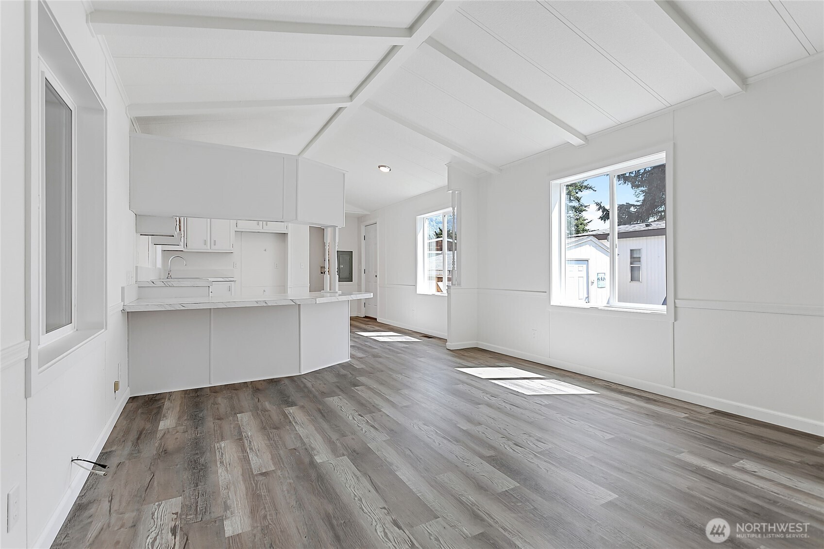 921 Autumn Lane, Unit 243 Bellingham, WA 98229 - Photo 4 of 24 a view of kitchen and hall with wooden floor