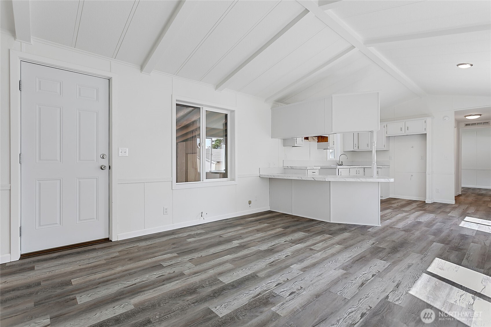 921 Autumn Lane, Unit 243 Bellingham, WA 98229 - Photo 5 of 24 a view of kitchen with wooden floor and window