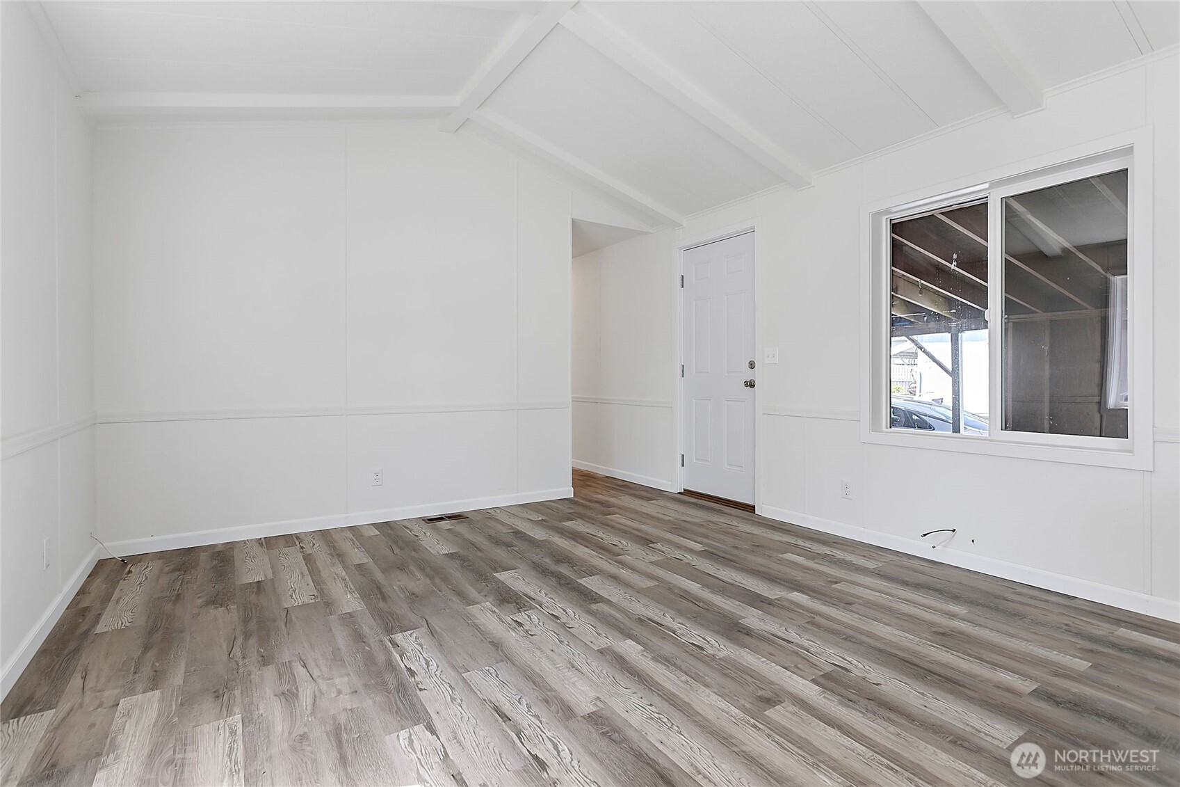 921 Autumn Lane, Unit 243 Bellingham, WA 98229 - Photo 6 of 24 a view of empty room with wooden floor and fan