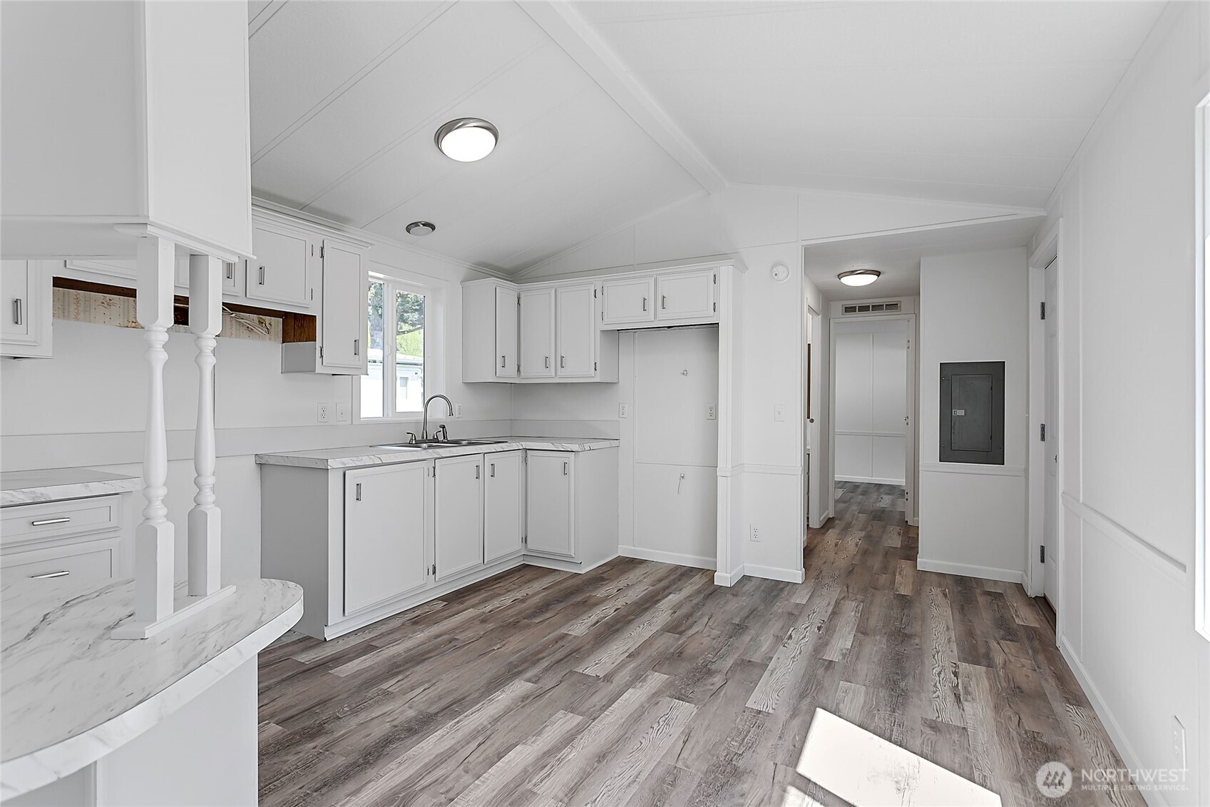921 Autumn Lane, Unit 243 Bellingham, WA 98229 - Photo 7 of 24 a kitchen with a refrigerator and a stove top oven