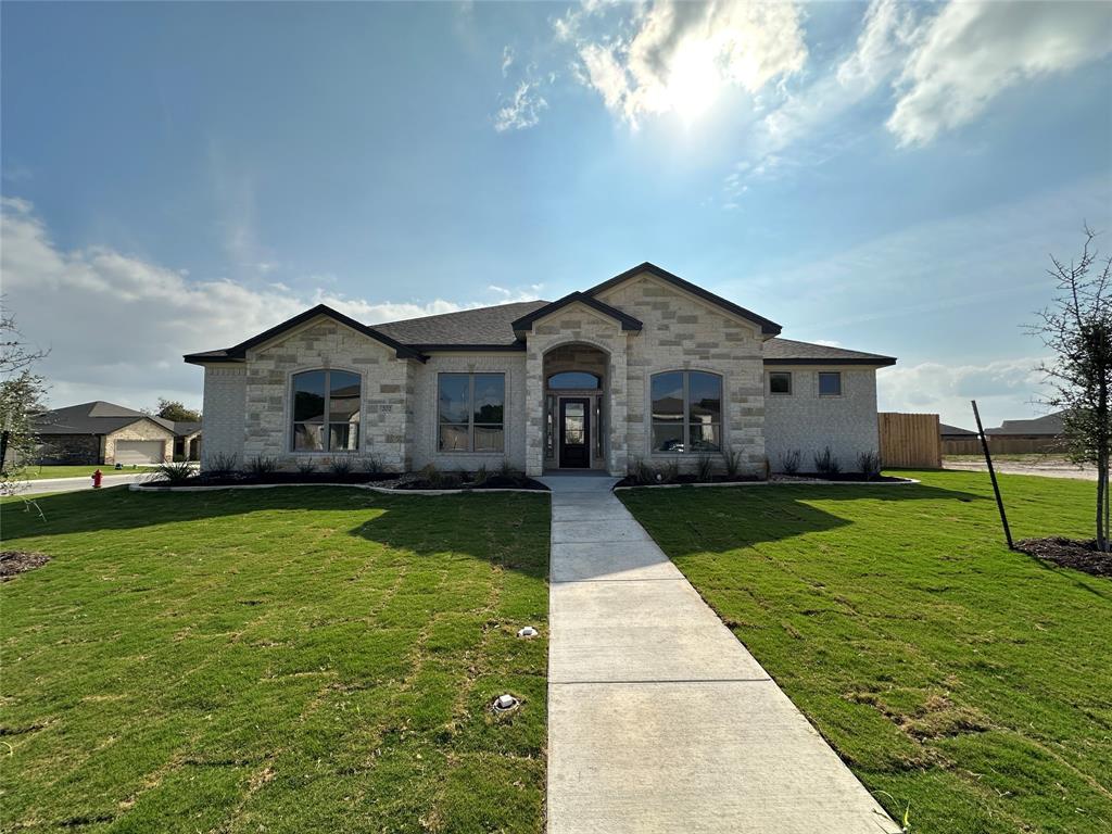 202 Lasso Loop Lorena, TX 76655 - Photo 1 of 1 French country inspired facade featuring stone siding