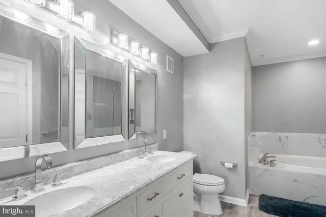 a bathroom with a bathtub and shower