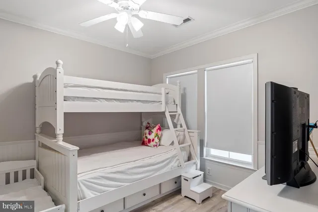 a bathroom with a sink vanity mirror and toilet