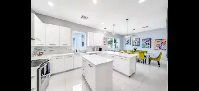 view of living room with furniture and floor to ceiling window