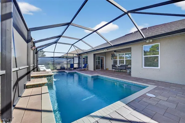 a view of a swimming pool with a patio