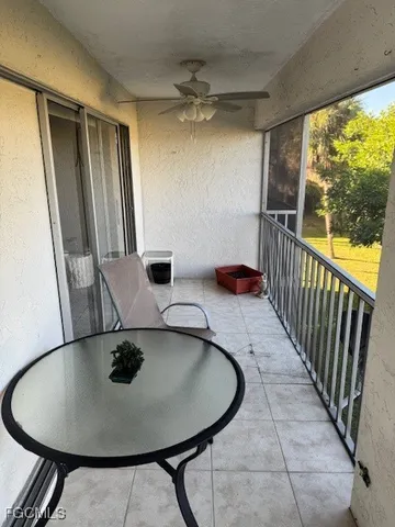 a dining room with furniture and a window