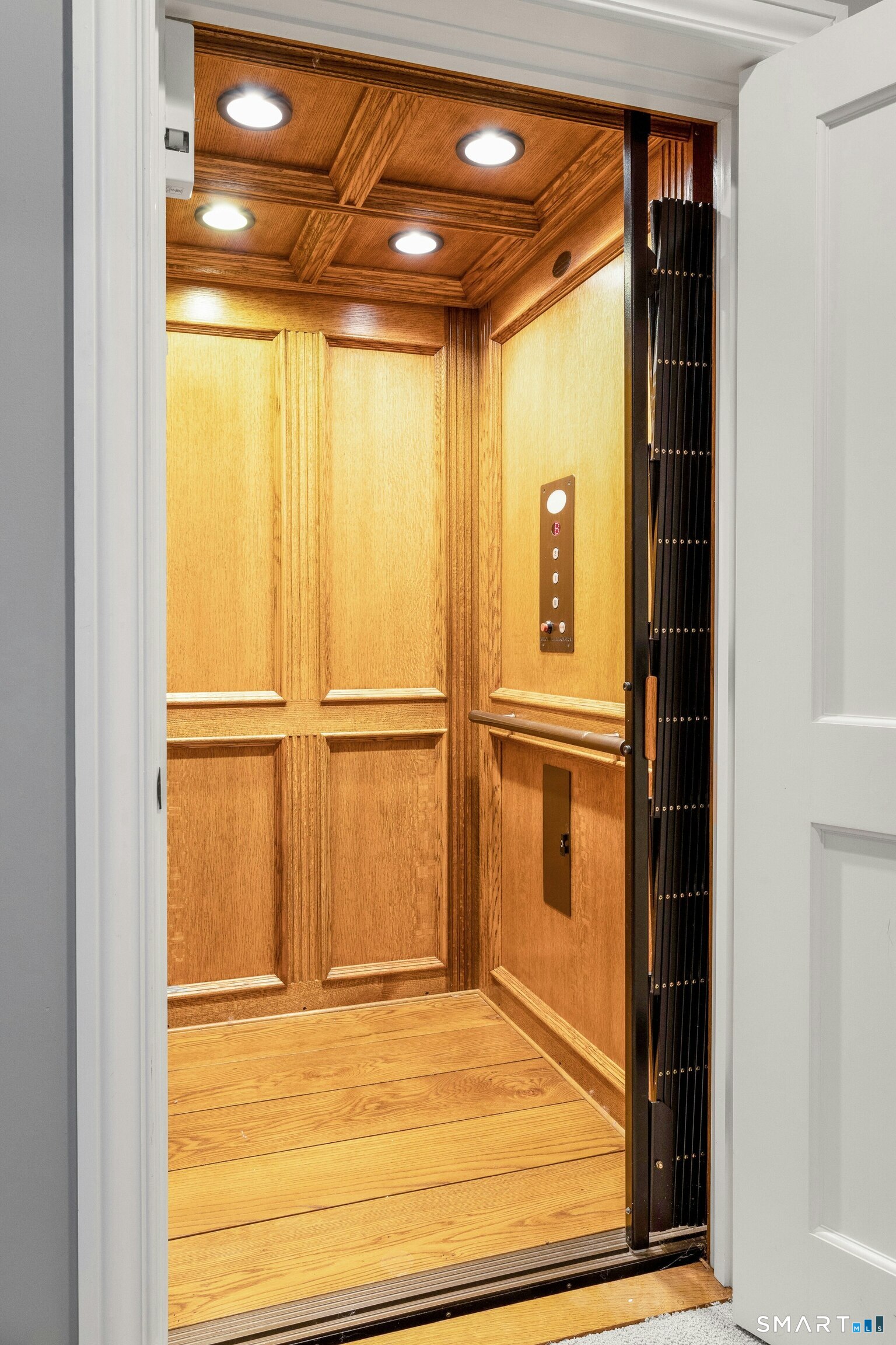 206 Umpawaug Road Redding, CT 06896 - Photo 31 of 40 Custom Paneled Elevator Serving Three Floors (Lower, Main, Second)
